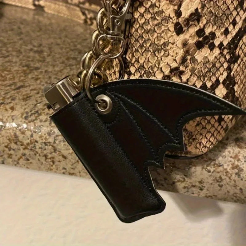 Black leather keychain attached as a cute purse charm